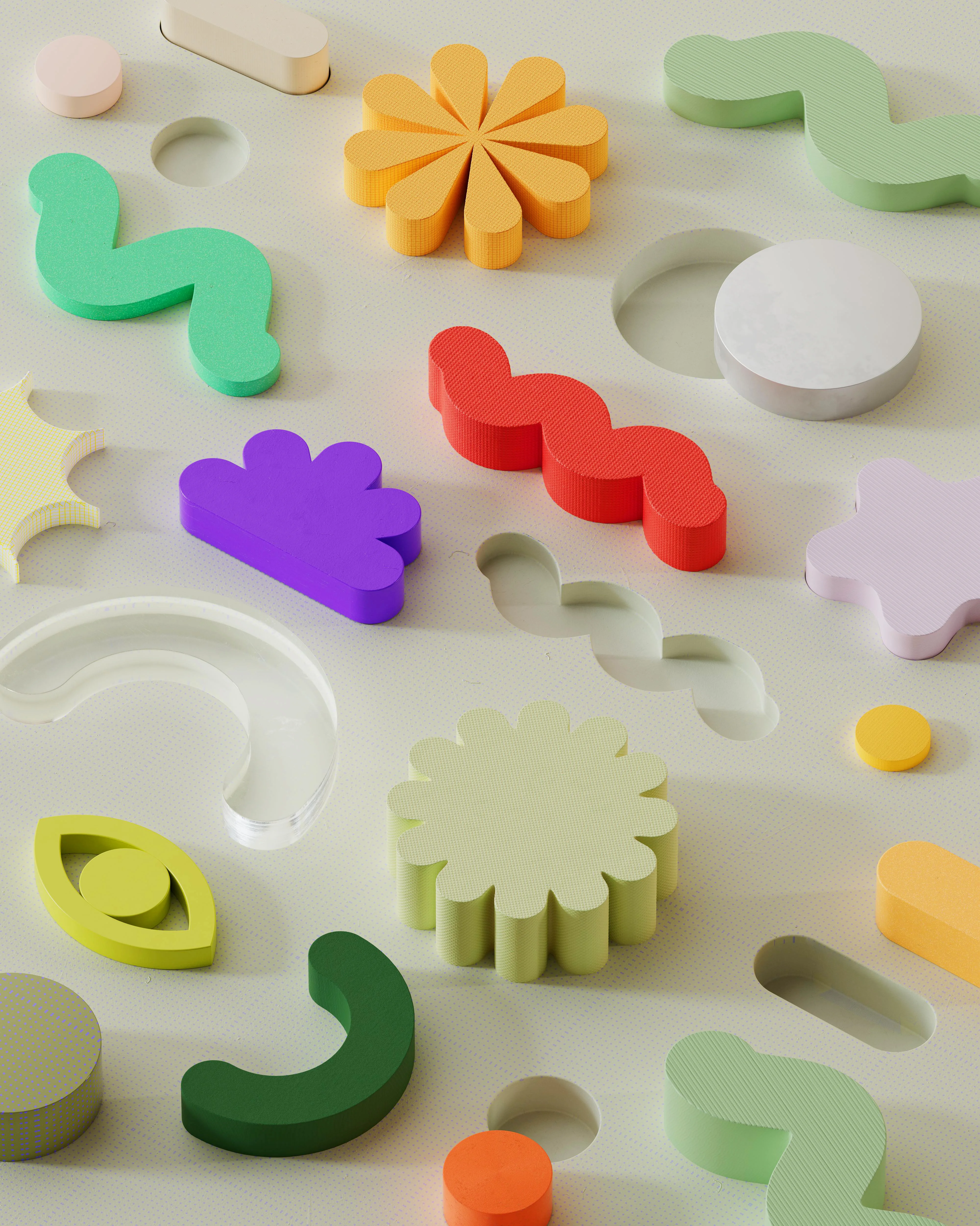 Das Bild zeigt eine Vielzahl bunter, unterschiedlich geformter Spiel- oder Puzzleteile aus Holz oder Kunststoff, die auf einer hellen, perforierten Oberfläche verteilt liegen. Einige der Teile liegen lose auf, andere sind in passende Aussparungen im Untergrund eingelegt. Die Formen sind kreativ und abstrakt – darunter Blumen, Wellenlinien, Halbkreise, Tropfen, Kreise, Augenformen und andere stilisierte Symbole. Die Farben sind kräftig und vielfältig, darunter Grün, Orange, Gelb, Rot, Lila, Weiß, Transparent und mehr. Die Szene wirkt verspielt, modern und taktil.